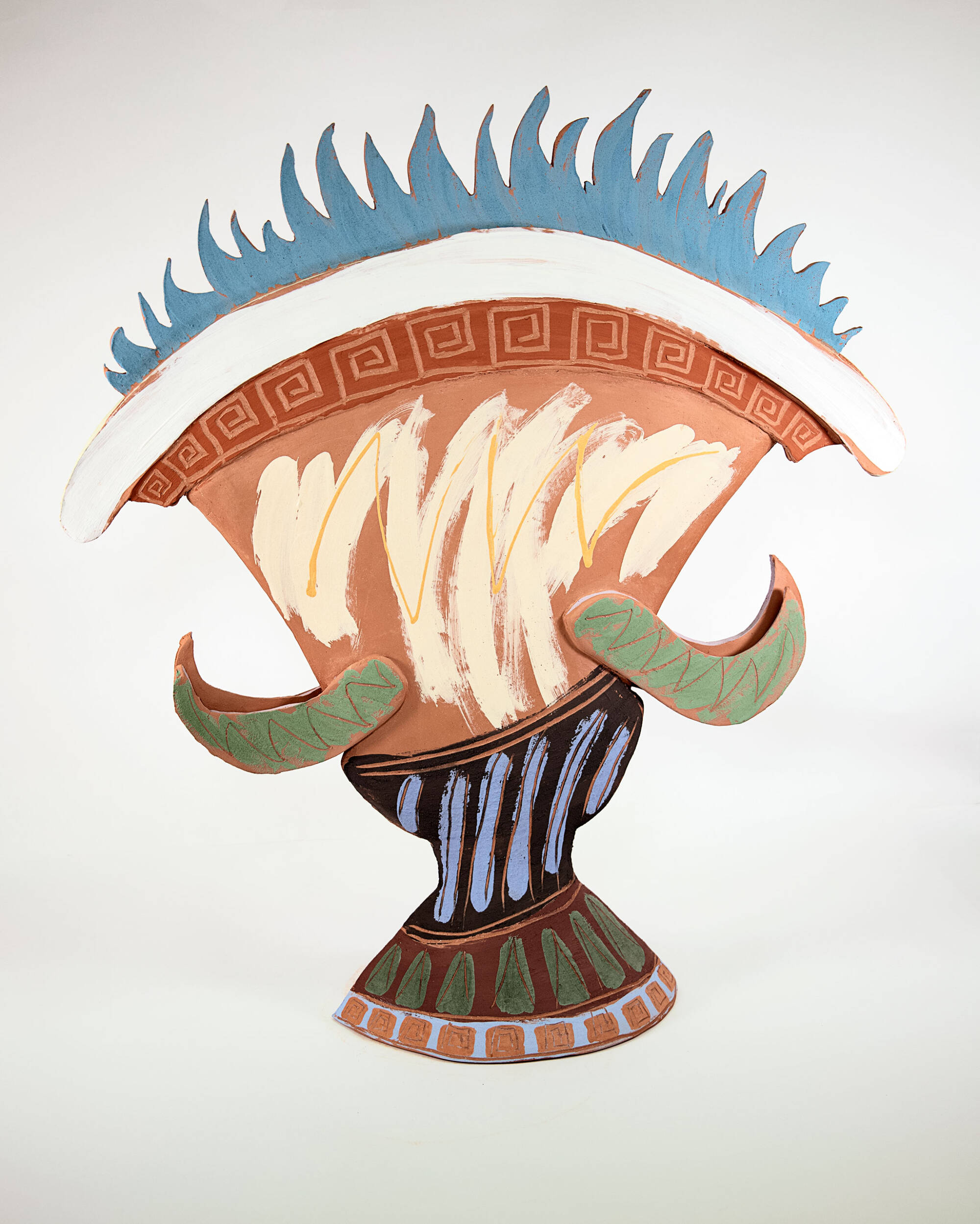 Ceramic sculpture inspired by a Greek vessel with various colors shapes and textures, blue flames coming out of the top.